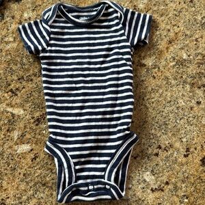 Carter’s navy/white stripe stretch jersey newborn onesie.